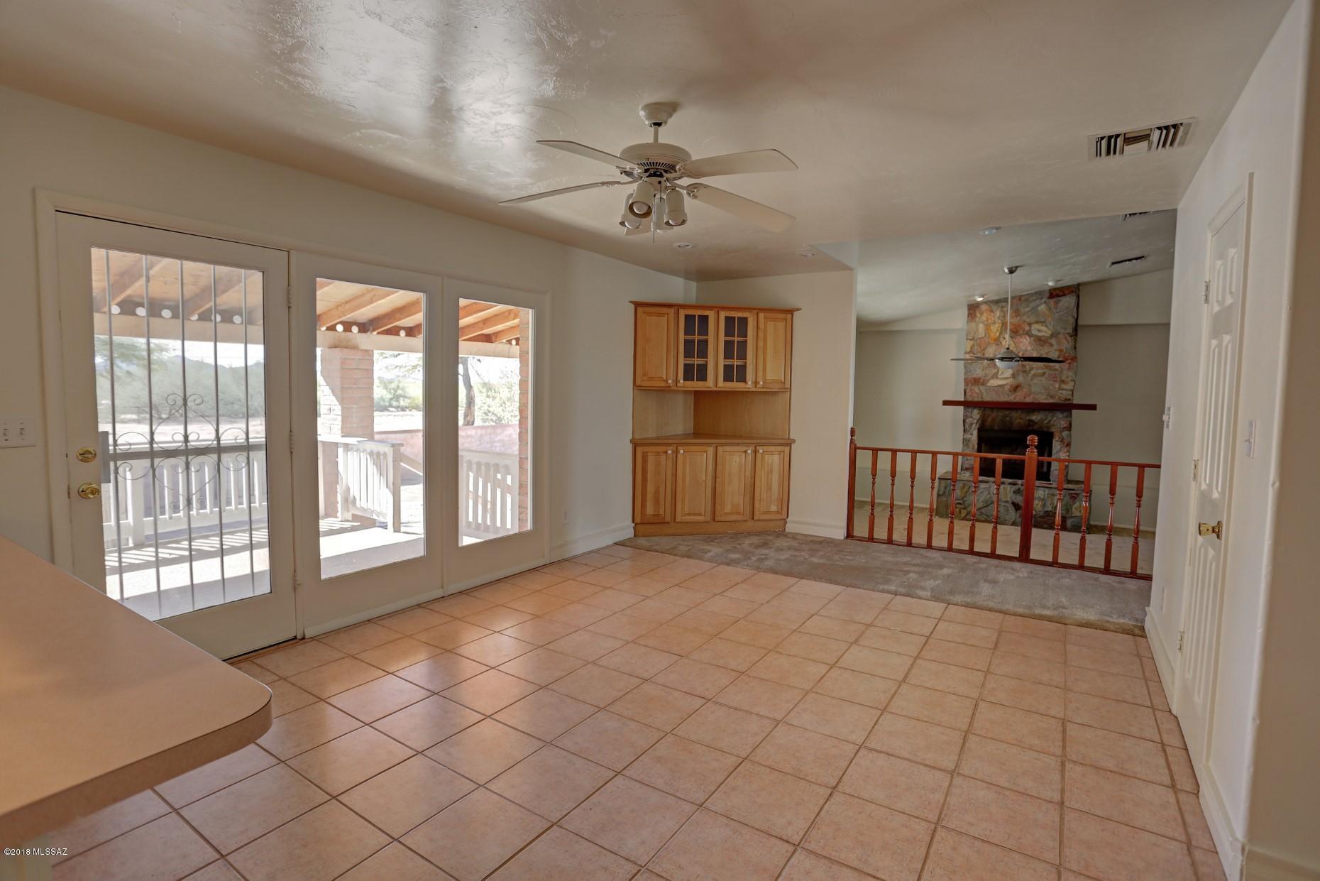 5851 South Avra Road Tucson, AZ 85735 - Photo 8 of 46 a view of an empty room with a window