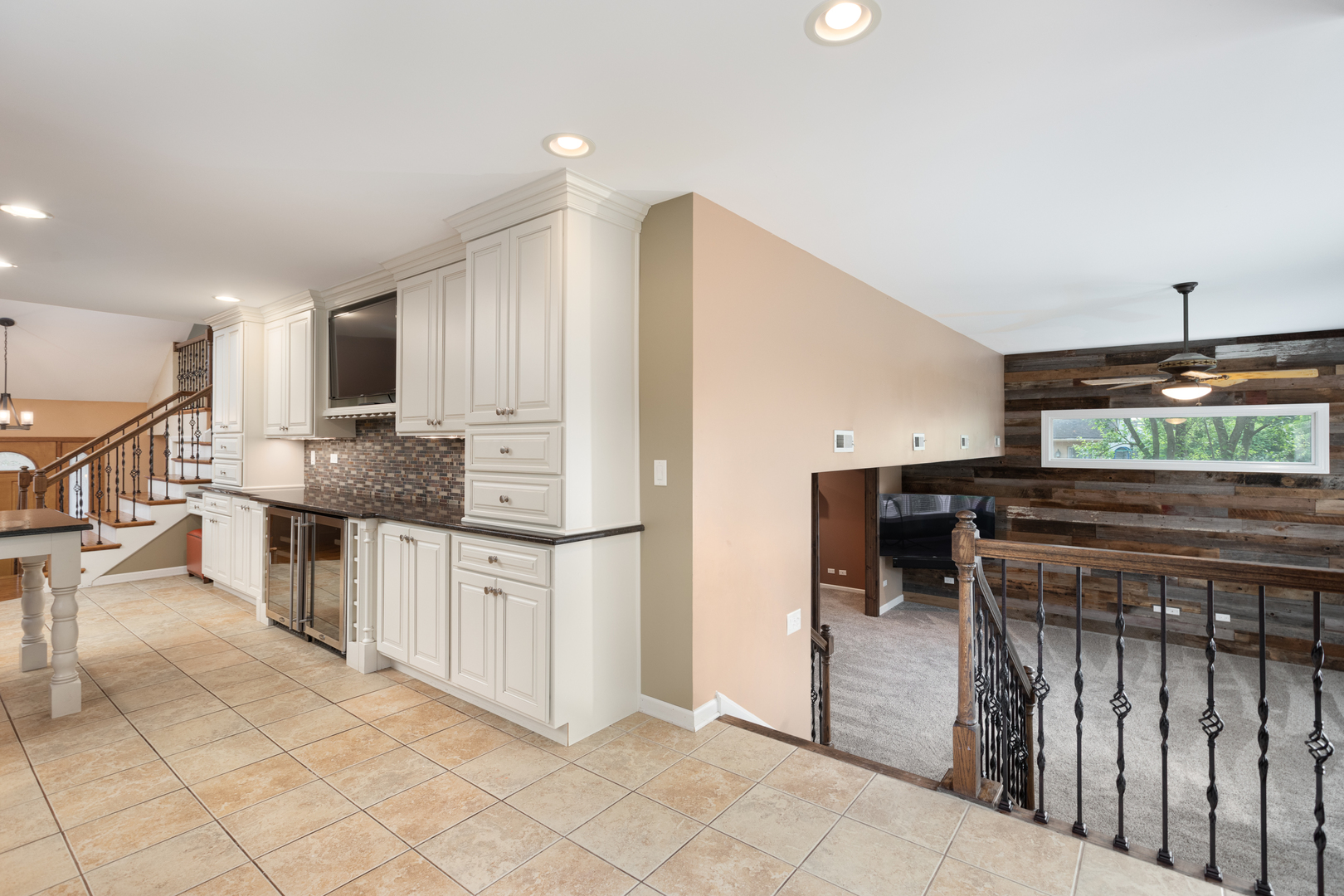 729 East Bauer Road Naperville, IL 60563 - Photo 12 of 57 a kitchen with stainless steel appliances kitchen island granite countertop a stove a sink and a refrigerator