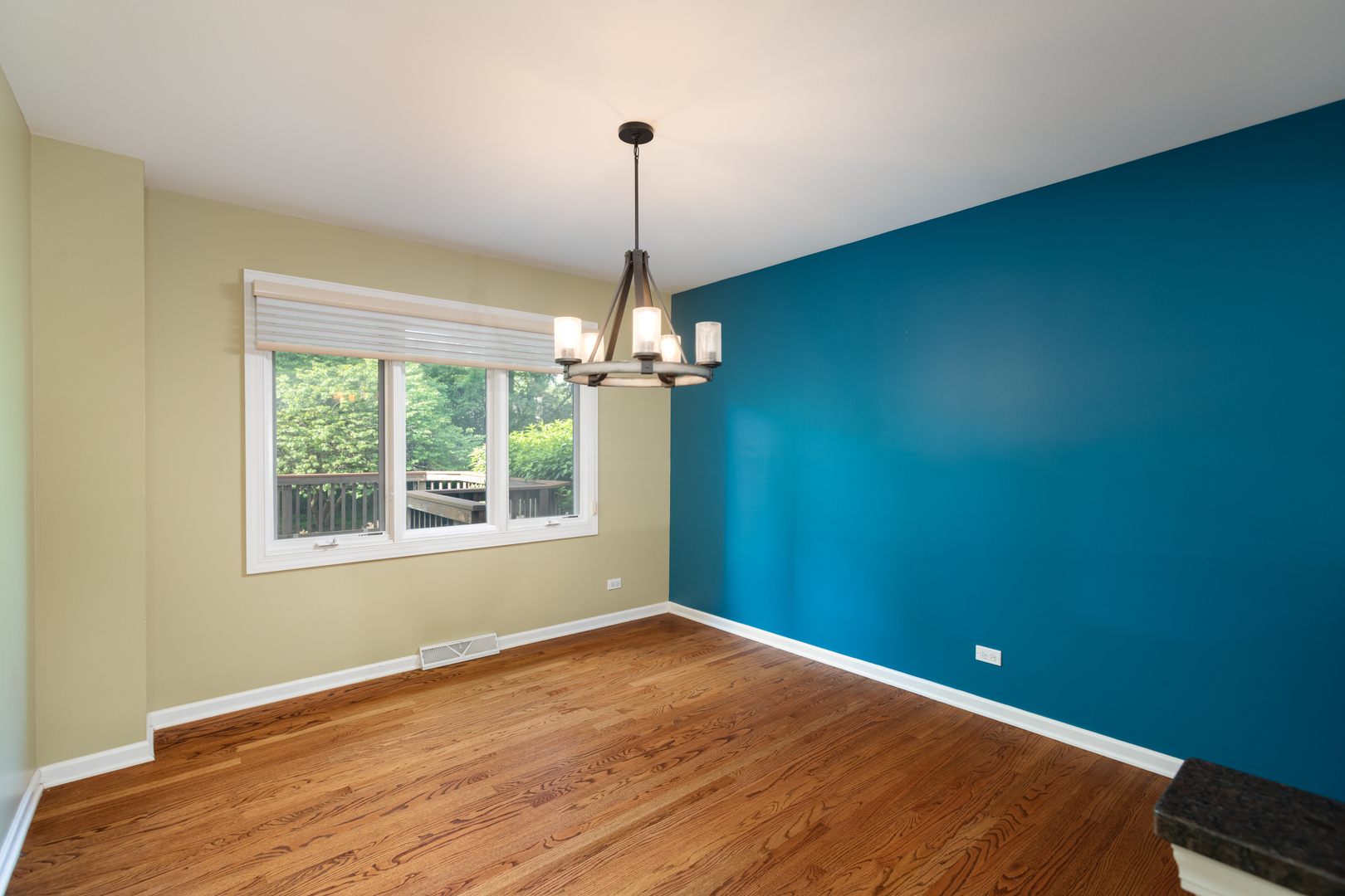 729 East Bauer Road Naperville, IL 60563 - Photo 18 of 57 a view of an empty room with wooden floor and a window