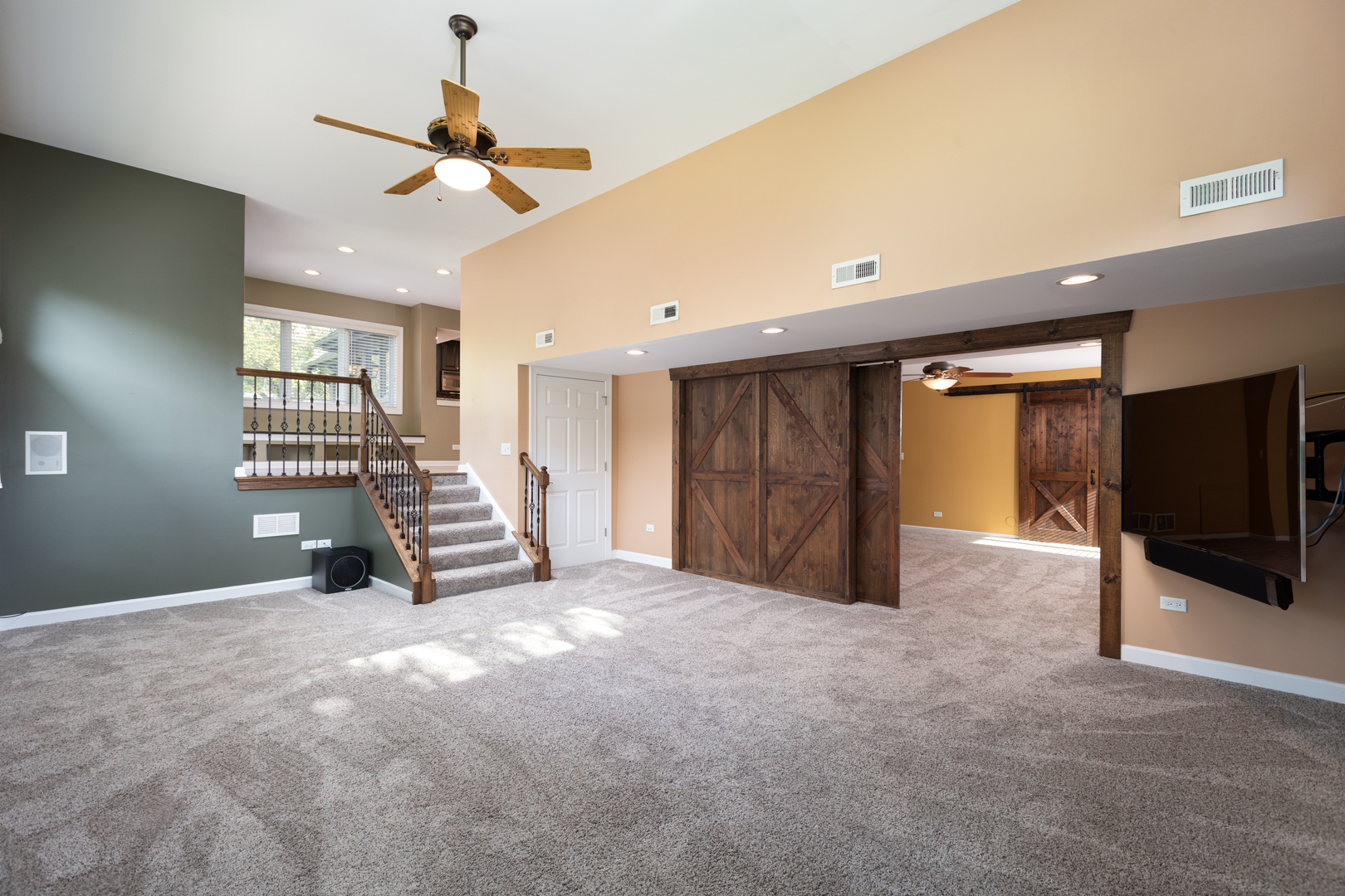 729 East Bauer Road Naperville, IL 60563 - Photo 22 of 57 a view of an empty room with a window and a flat screen tv