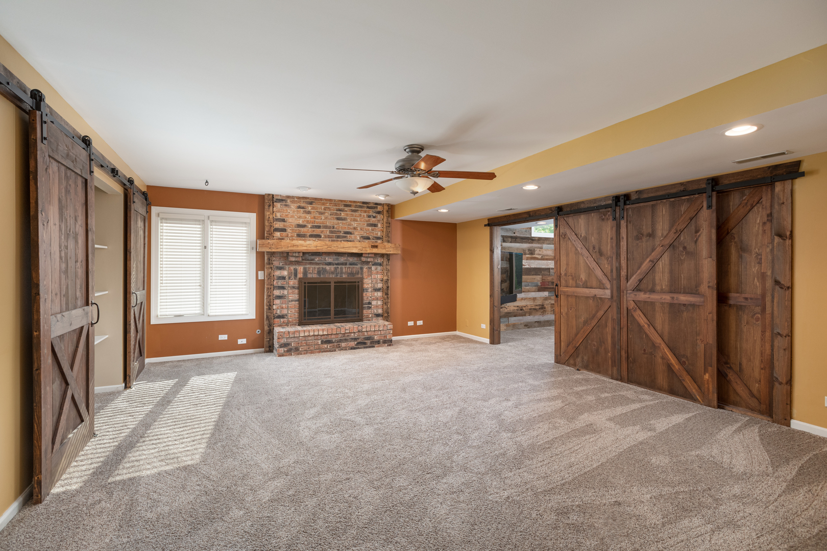 729 East Bauer Road Naperville, IL 60563 - Photo 25 of 57 a view of an empty room with a fireplace and a window