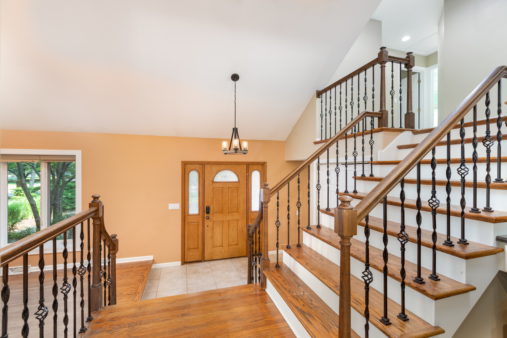729 East Bauer Road Naperville, IL 60563 - Photo 30 of 57 a view of staircase with railing and a chandelier