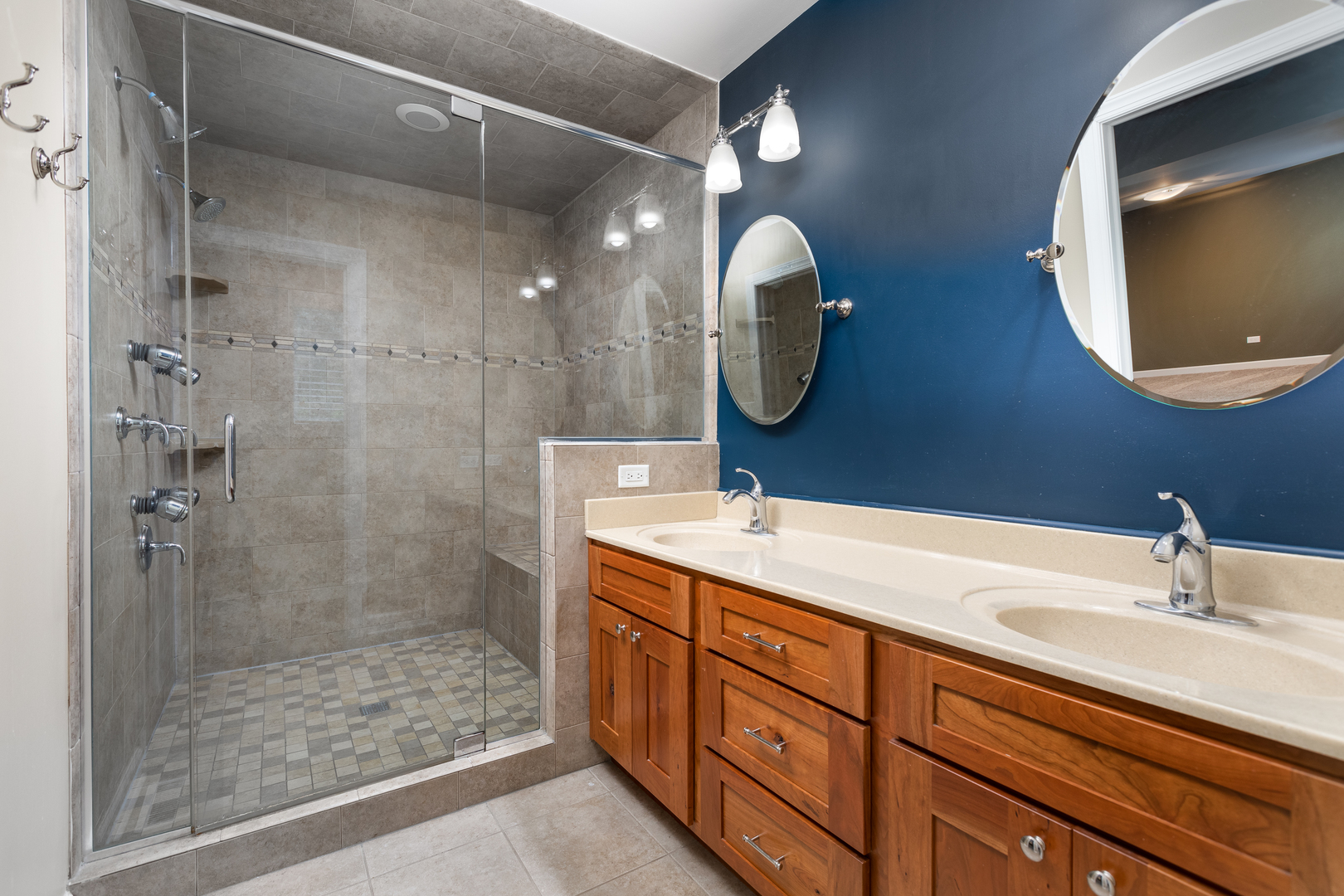 729 East Bauer Road Naperville, IL 60563 - Photo 34 of 57 a bathroom with a sink a light fixture and a mirror