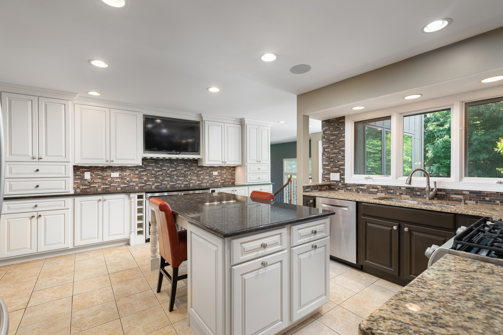 729 East Bauer Road Naperville, IL 60563 - Photo 6 of 57 a kitchen with granite countertop sink stove and cabinets