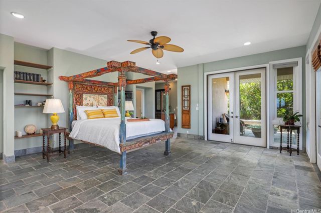 a bed room with a bed and a chandelier