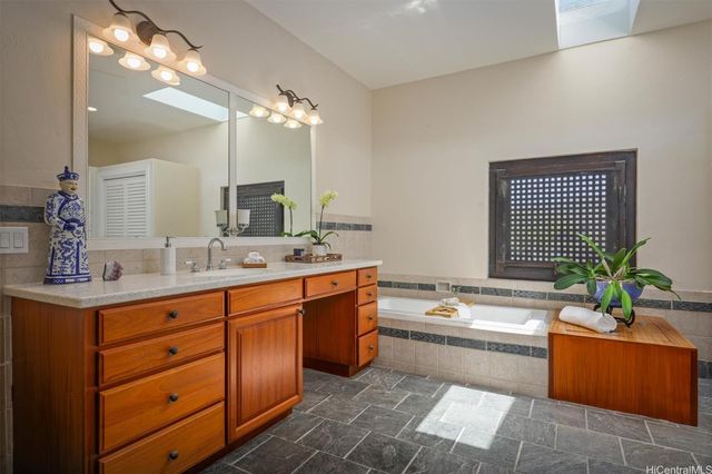 a bedroom with a bed and glass window