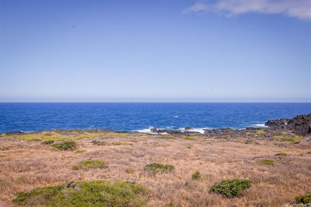 a view of a lake with a yard