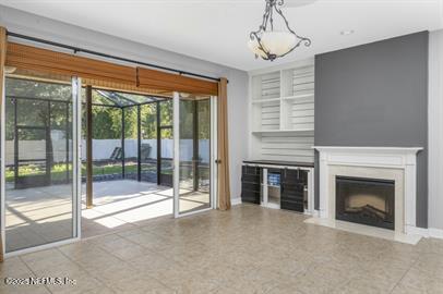 32330 Sunny Parke Drive Fernandina Beach, FL 32034 - Photo 13 of 38 a view of an empty room with a fireplace and a window