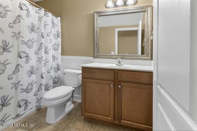 32330 Sunny Parke Drive Fernandina Beach, FL 32034 - Photo 30 of 38 a bathroom with a toilet sink and mirror