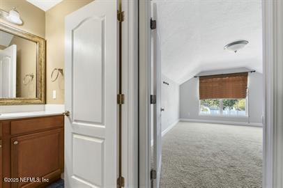 32330 Sunny Parke Drive Fernandina Beach, FL 32034 - Photo 35 of 38 a view of hallway with a sink and a mirror