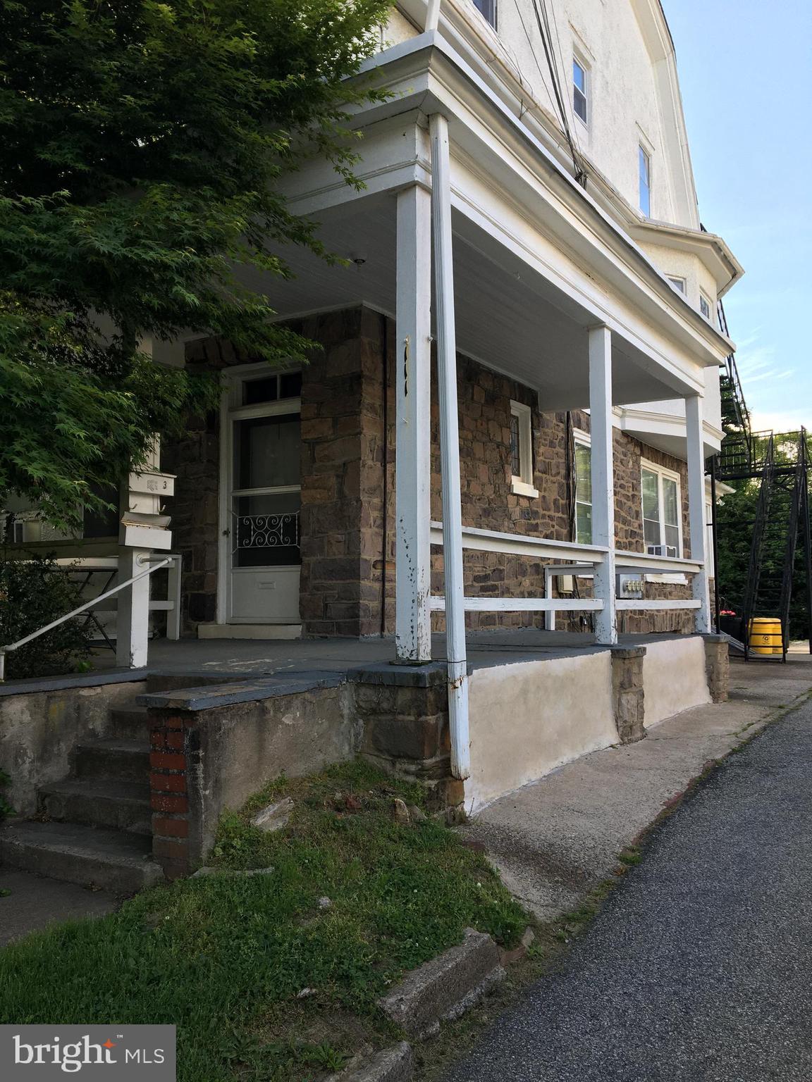front view of a house with a small yard