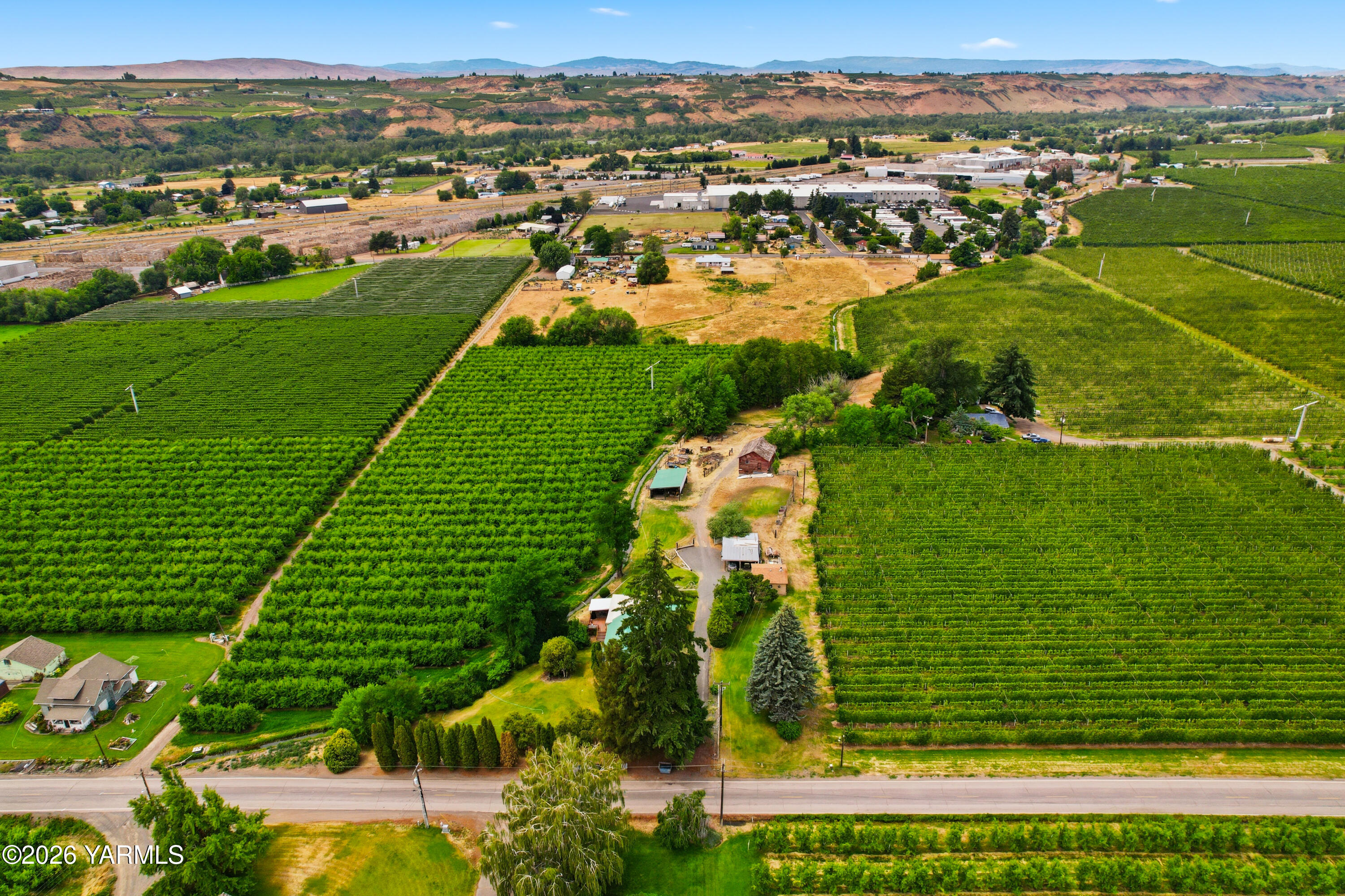 690 North Gleed Road Naches, WA 98937 - Photo 47 of 60 an aerial view of residential houses with outdoor space and trees