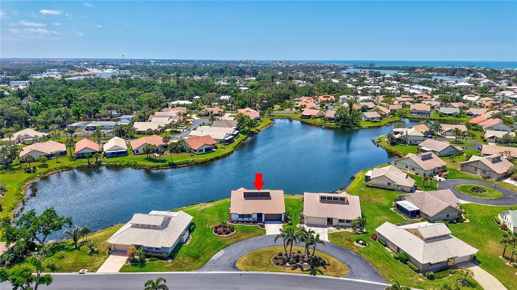 75 Inlets Boulevard, Unit 75 Nokomis, FL 34275 - Photo 1 of 1 an aerial view of house with yard swimming pool and ocean view