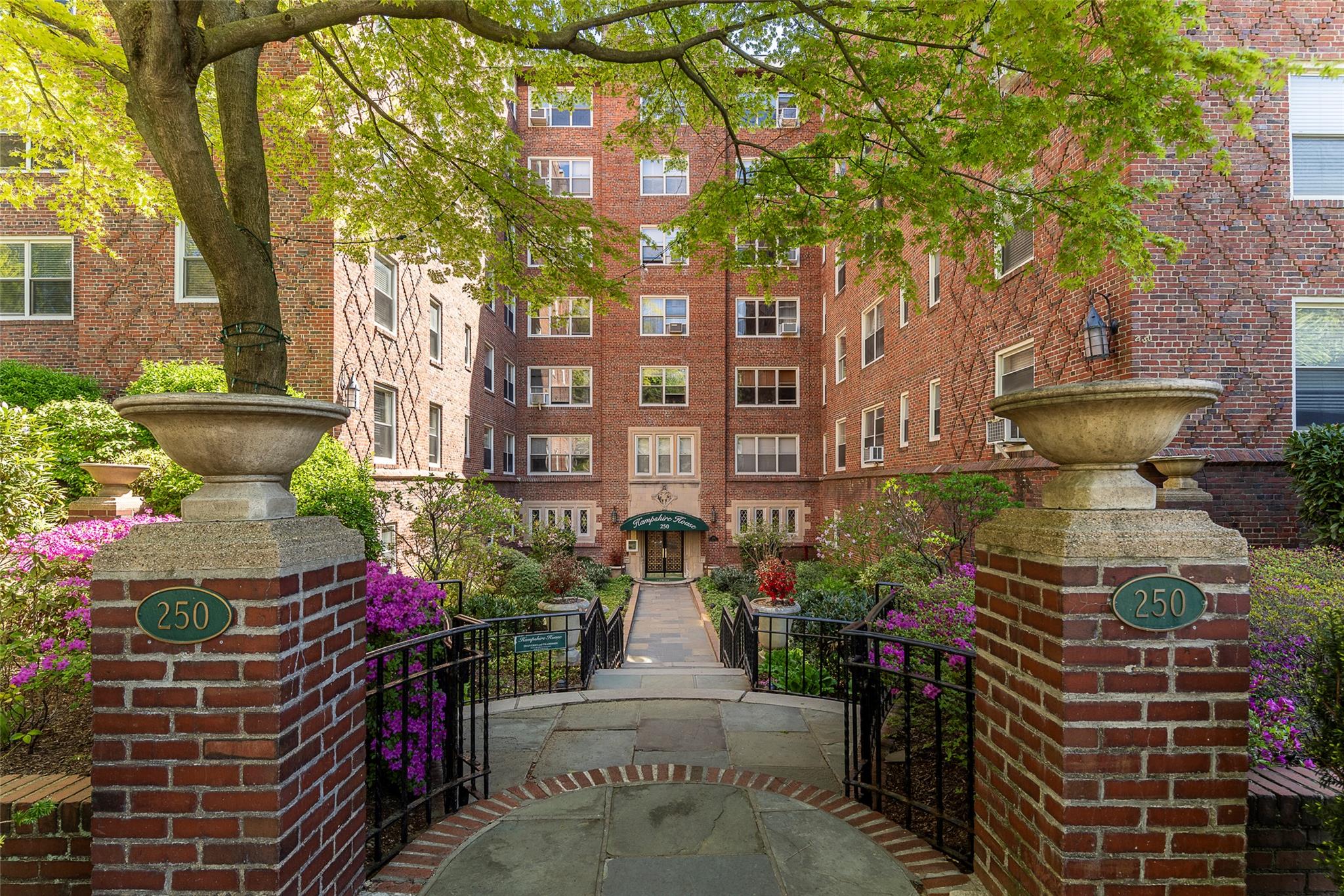 250 Bronxville Road, Unit 6B Bronxville, NY 10708 - Photo 1 of 1 250 Bronxville Road entrance with lovely landscaped courtyard