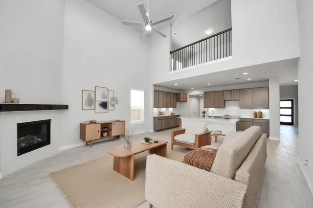 a living room with furniture and fireplace