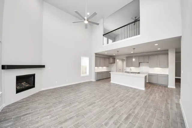 a view of kitchen and hall with wooden floor