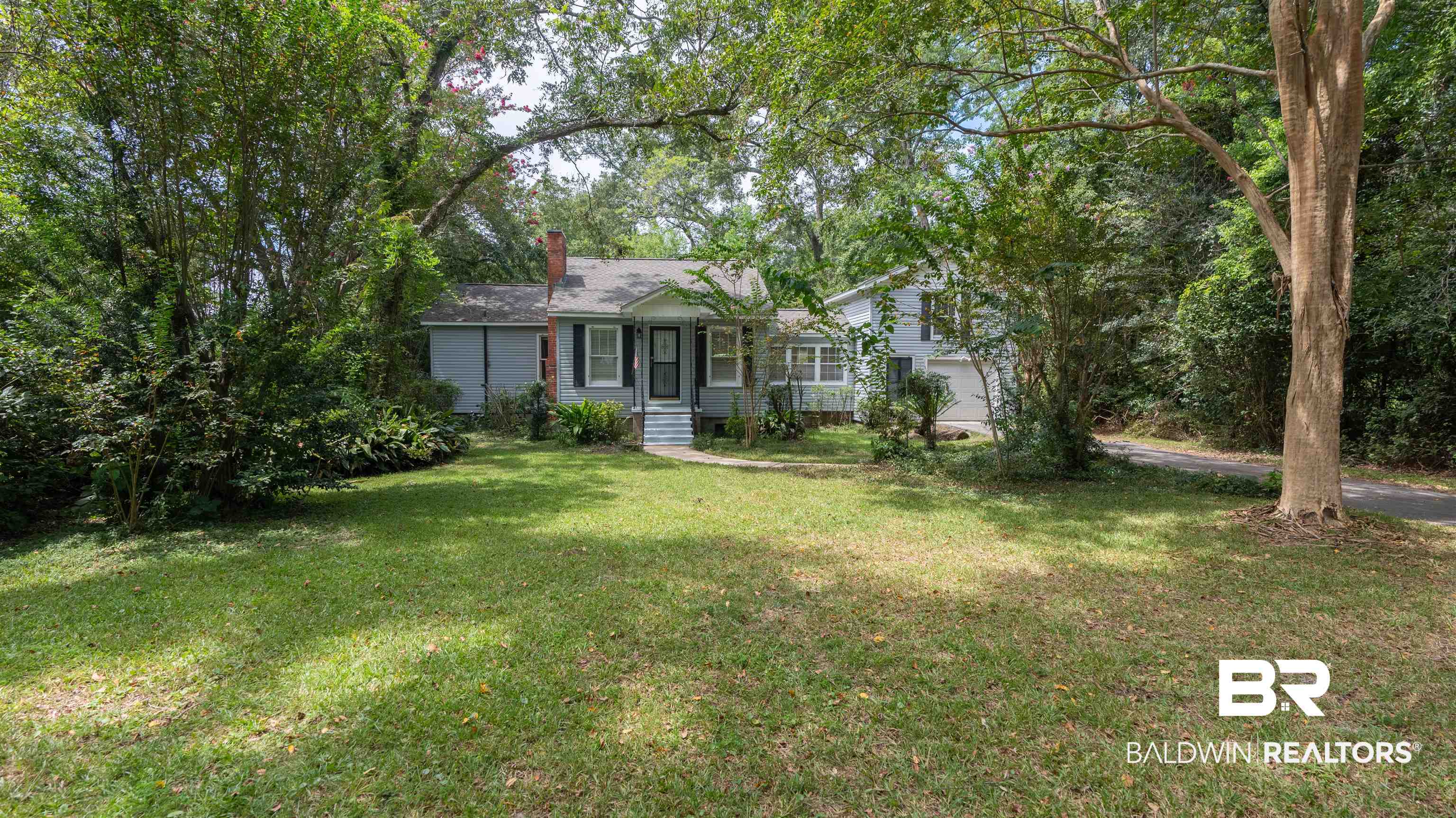 2126 Barron Place Mobile, AL 36605 - Photo 4 of 33 Ranch-style house featuring a garage and a front lawn