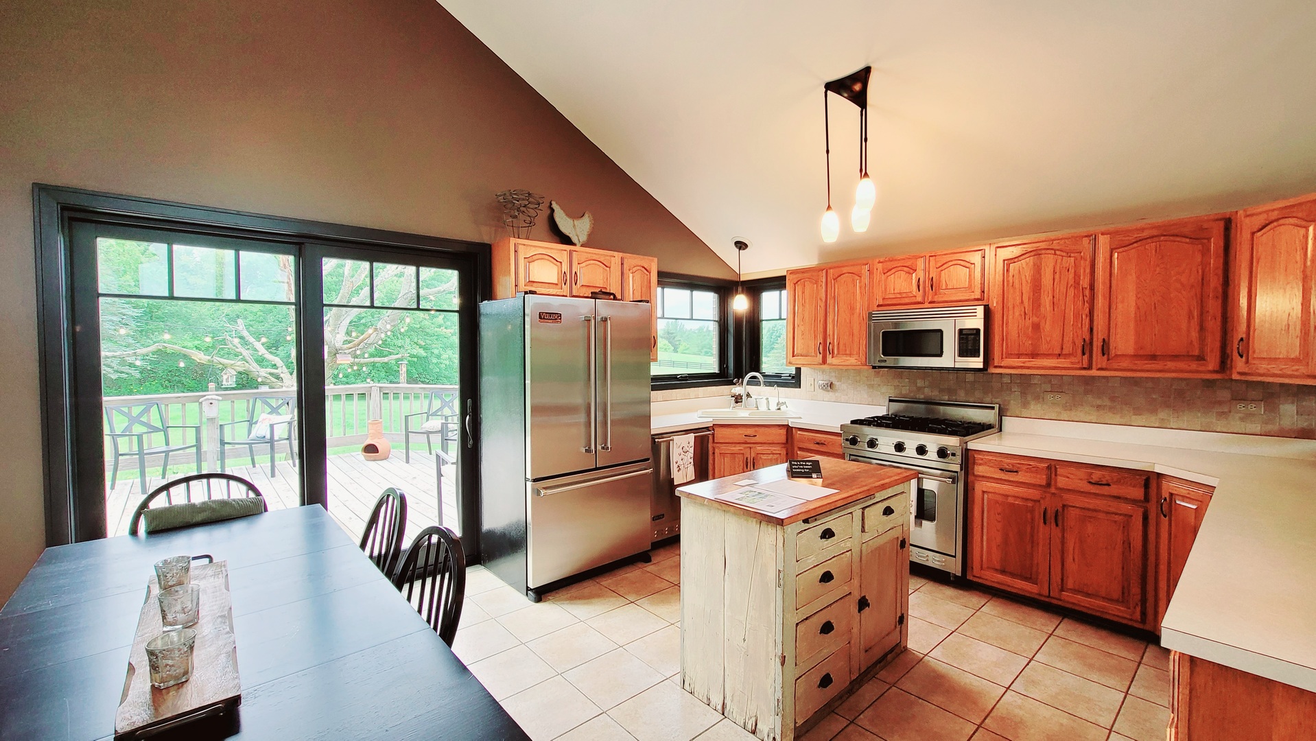 6514 Hamilton Road Huntley, IL 60142 - Photo 6 of 40 a kitchen with stainless steel appliances granite countertop a refrigerator a stove top oven a sink dishwasher and white cabinets with wooden floor