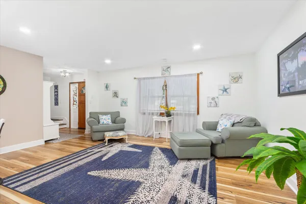 a living room with furniture and a rug