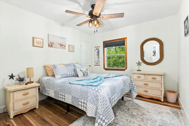 a bedroom with a bed and a dresser