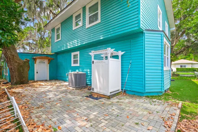 a bathroom with a shower and a window