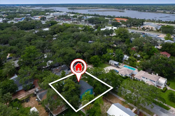an aerial view of residential house with outdoor space and street view