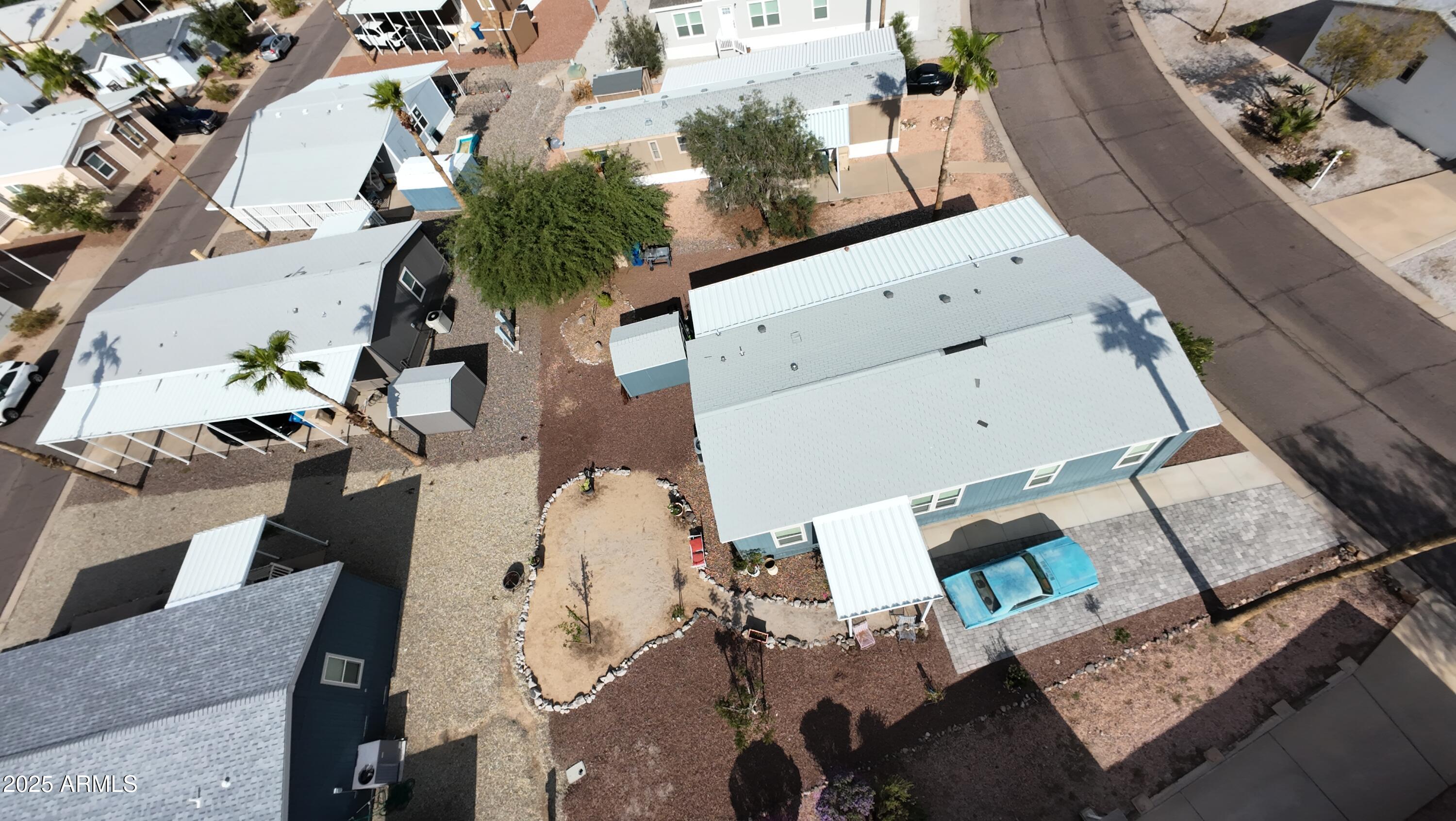 2000 South Apache Road, Unit 277 Buckeye, AZ 85326 - Photo 2 of 13 an aerial view of a house with a yard and sitting area