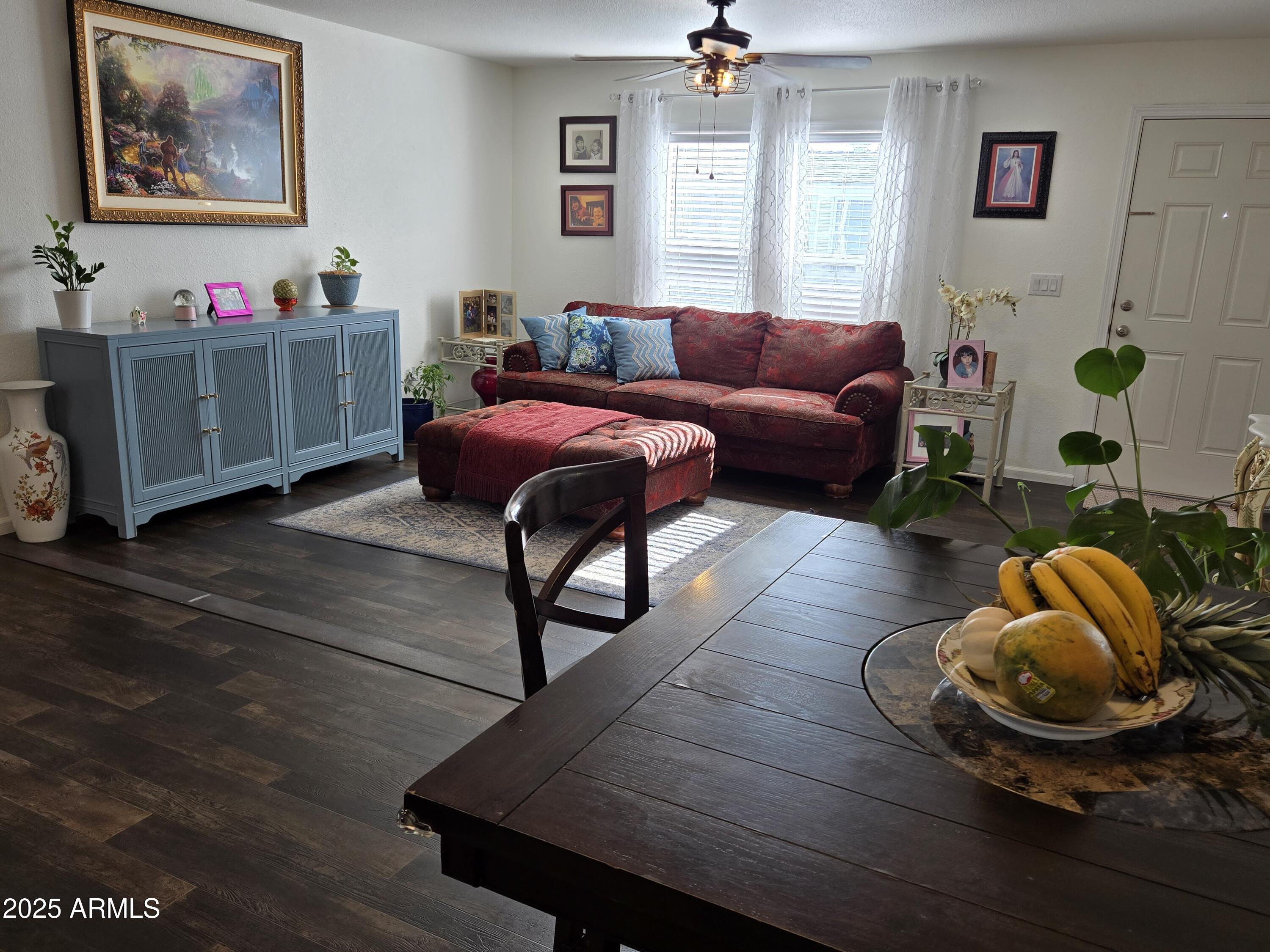 2000 South Apache Road, Unit 277 Buckeye, AZ 85326 - Photo 7 of 13 a living room with furniture and wooden floor