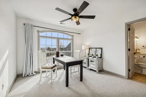 a work room with furniture and a window