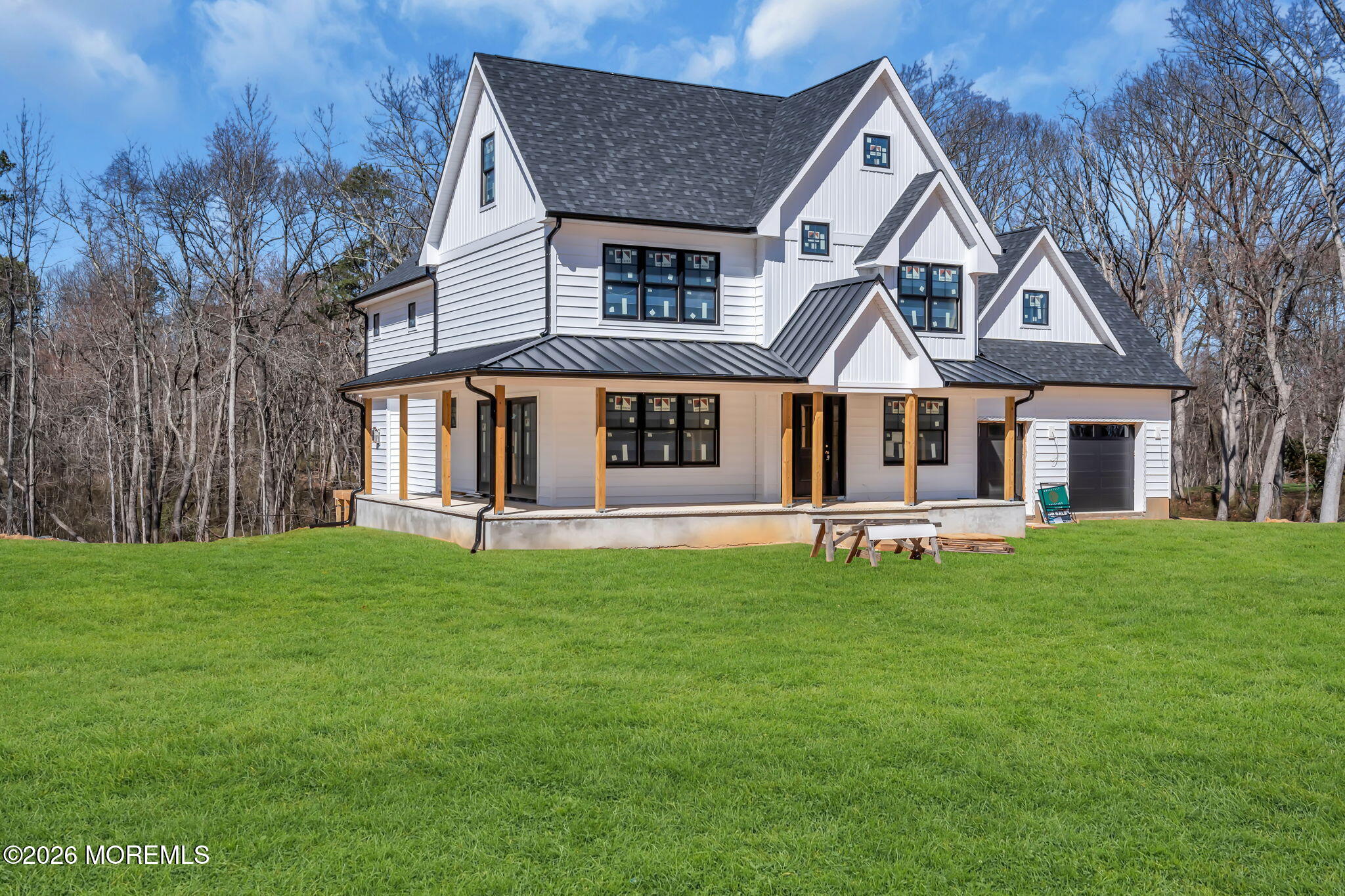 104 Back Bone Hill Road Millstone Township, NJ 08510 - Photo 5 of 26 a front view of a house with a garden and porch