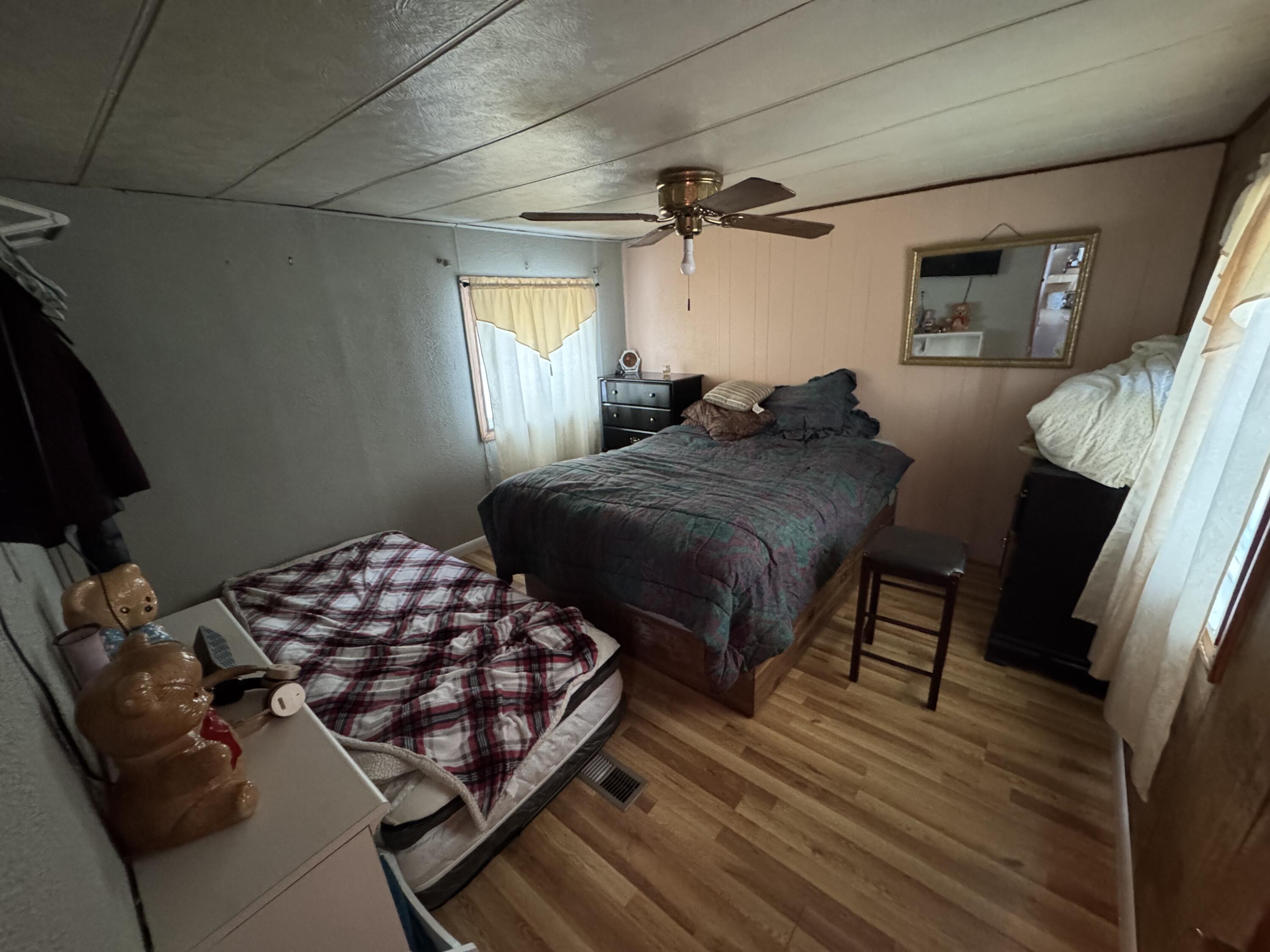 1741 Scott Road Olyphant, PA 18447 - Photo 11 of 11 a bedroom with a bed and wooden floor