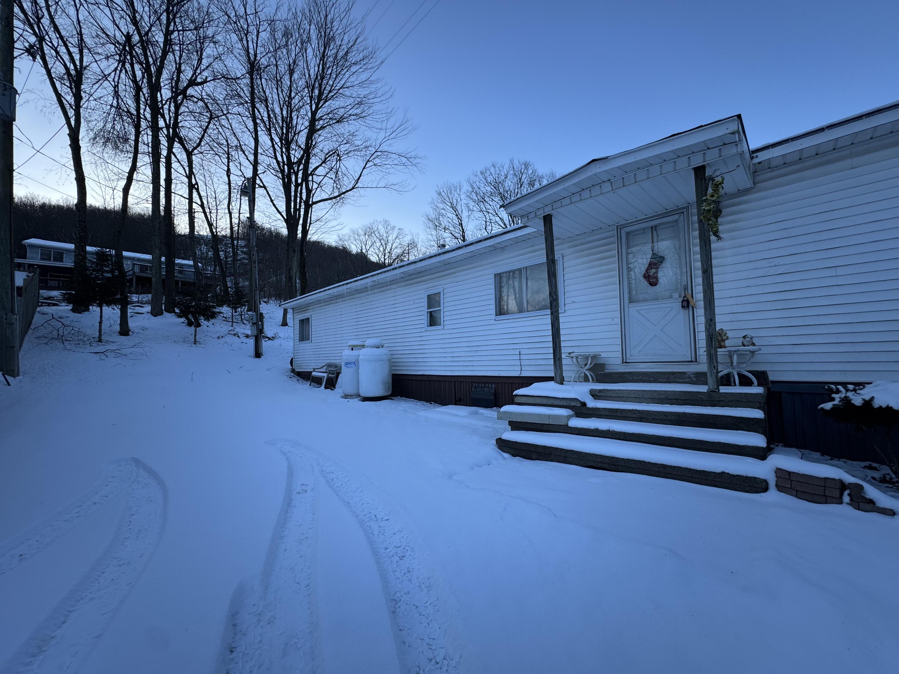 1741 Scott Road Olyphant, PA 18447 - Photo 2 of 11 a view of house with outdoor space and seating area
