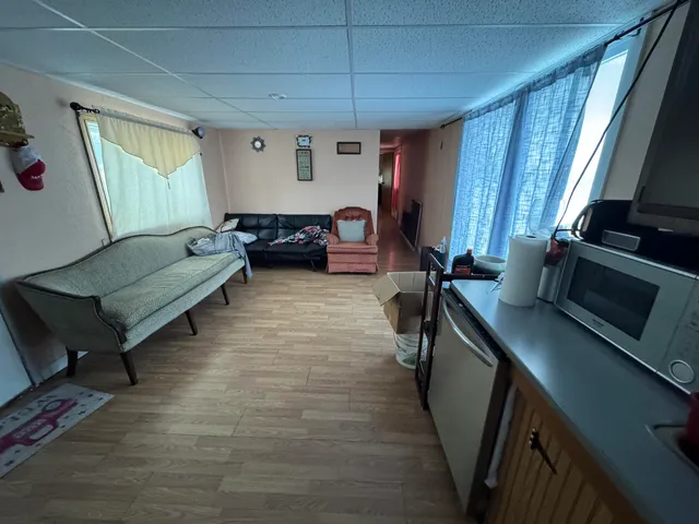 a bedroom with furniture and a window