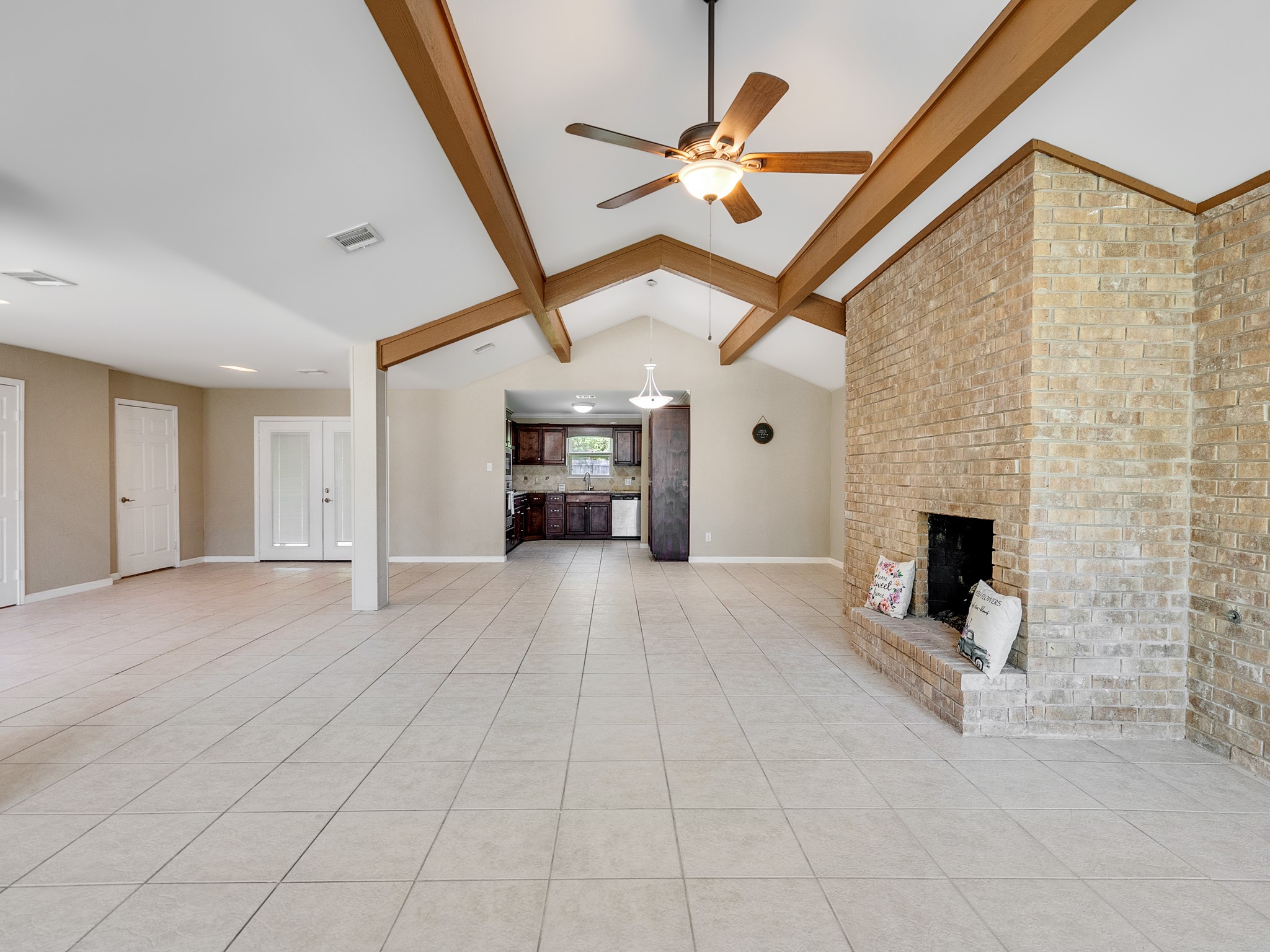 603 Casper Court Spring, TX 77373 - Photo 6 of 31 View from the front windows a primary room to the left. The hall to the right and the kitchen to the back.