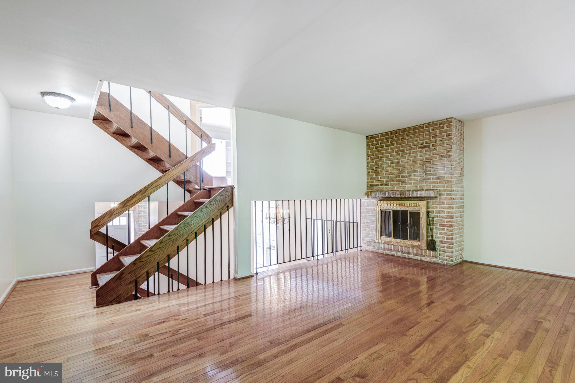73 Wedge Lane Reading, PA 19607 - Photo 8 of 23 Spacious living area with elegant staircase.