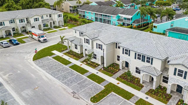 a aerial view of a house with a yard