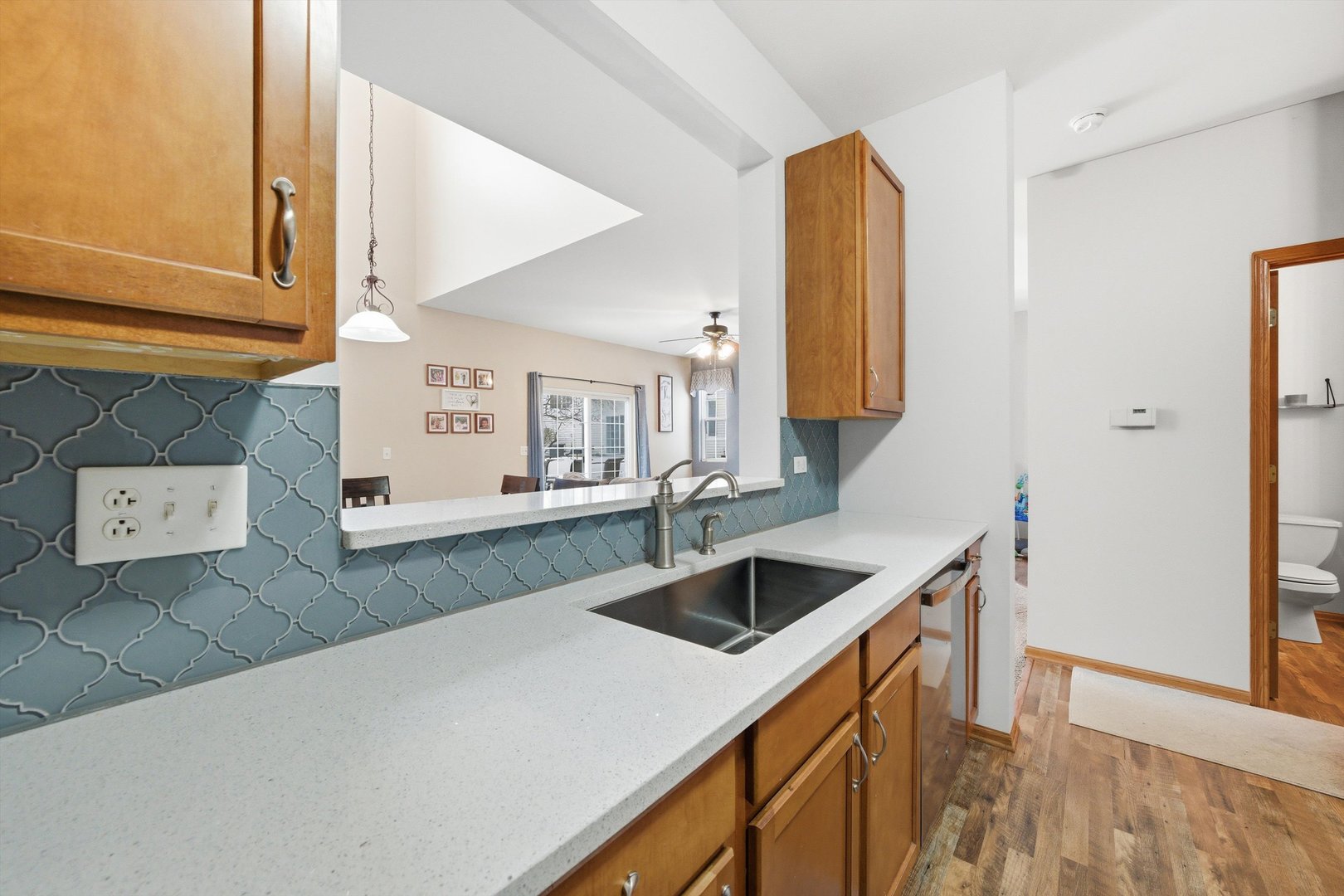 1110 Colonial Drive Joliet, IL 60432 - Photo 12 of 36 a kitchen with a sink and a refrigerator