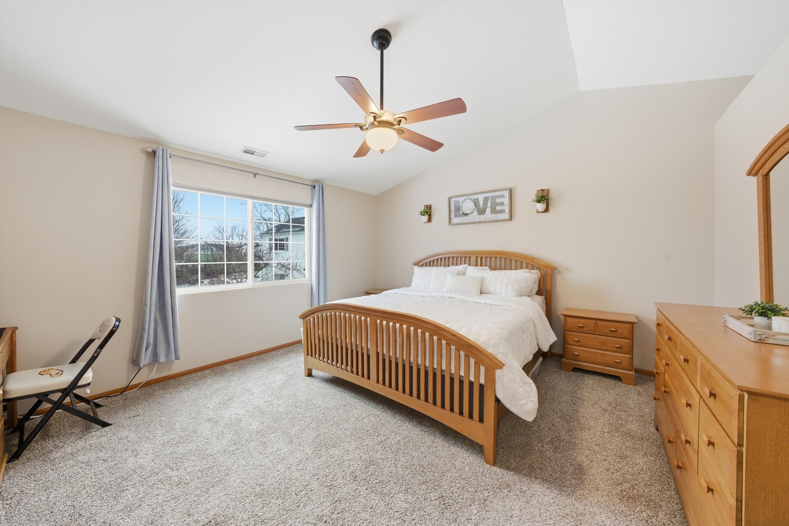 1110 Colonial Drive Joliet, IL 60432 - Photo 16 of 36 a bedroom with a bed and a window
