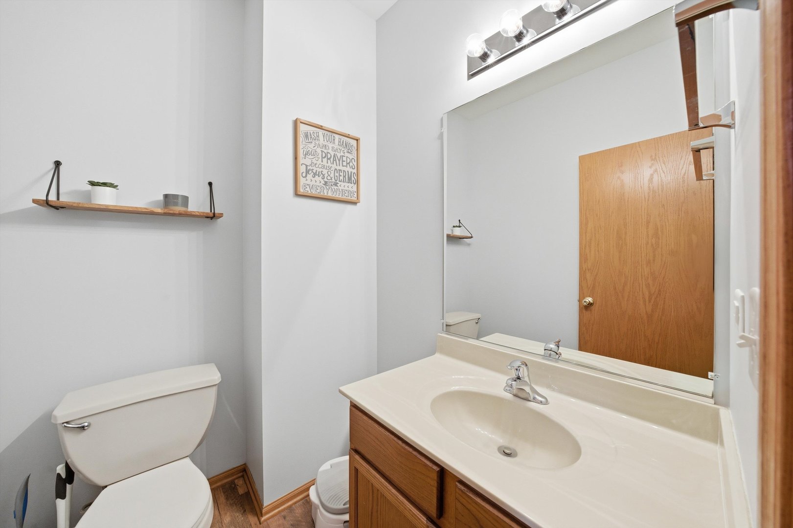 1110 Colonial Drive Joliet, IL 60432 - Photo 23 of 36 a bathroom with a toilet sink and mirror