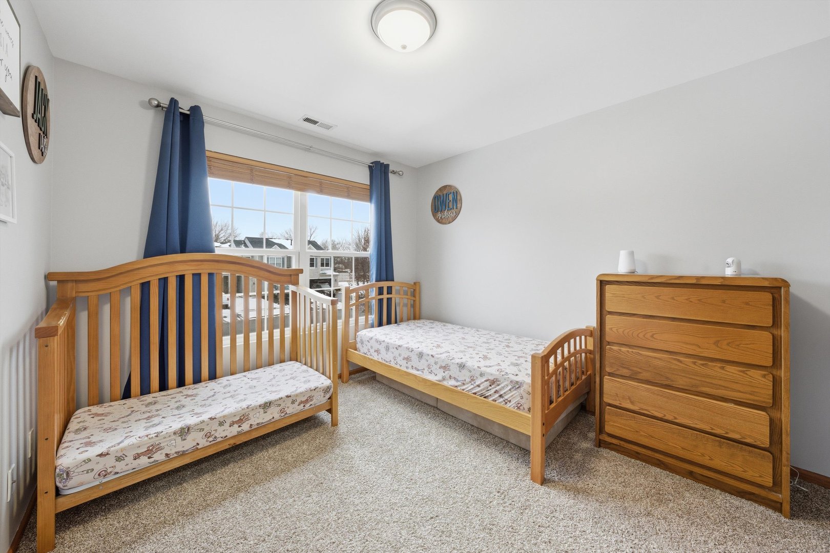 1110 Colonial Drive Joliet, IL 60432 - Photo 24 of 36 a bedroom with a bed and a window