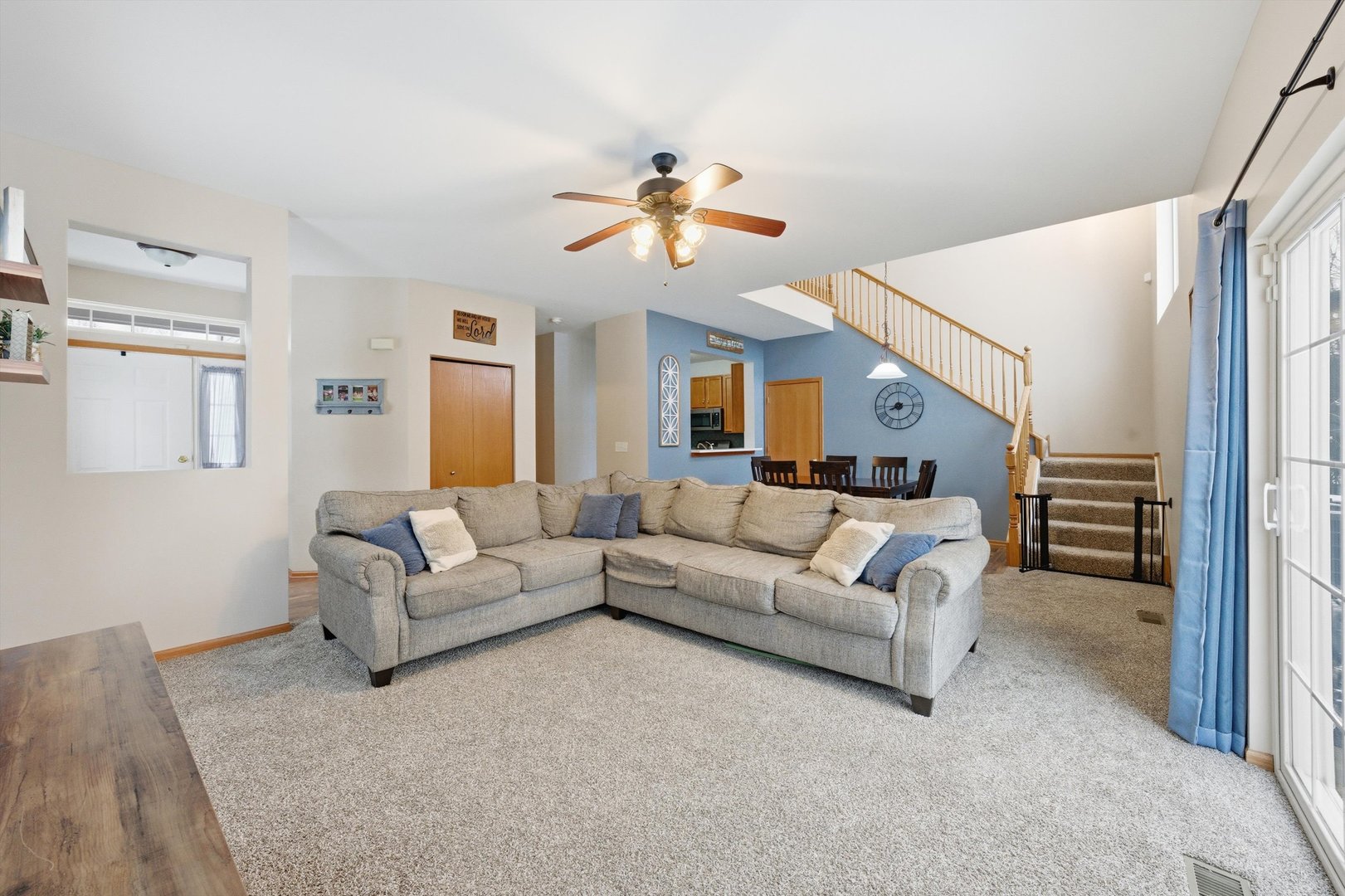 1110 Colonial Drive Joliet, IL 60432 - Photo 7 of 36 a living room with furniture and a chandelier