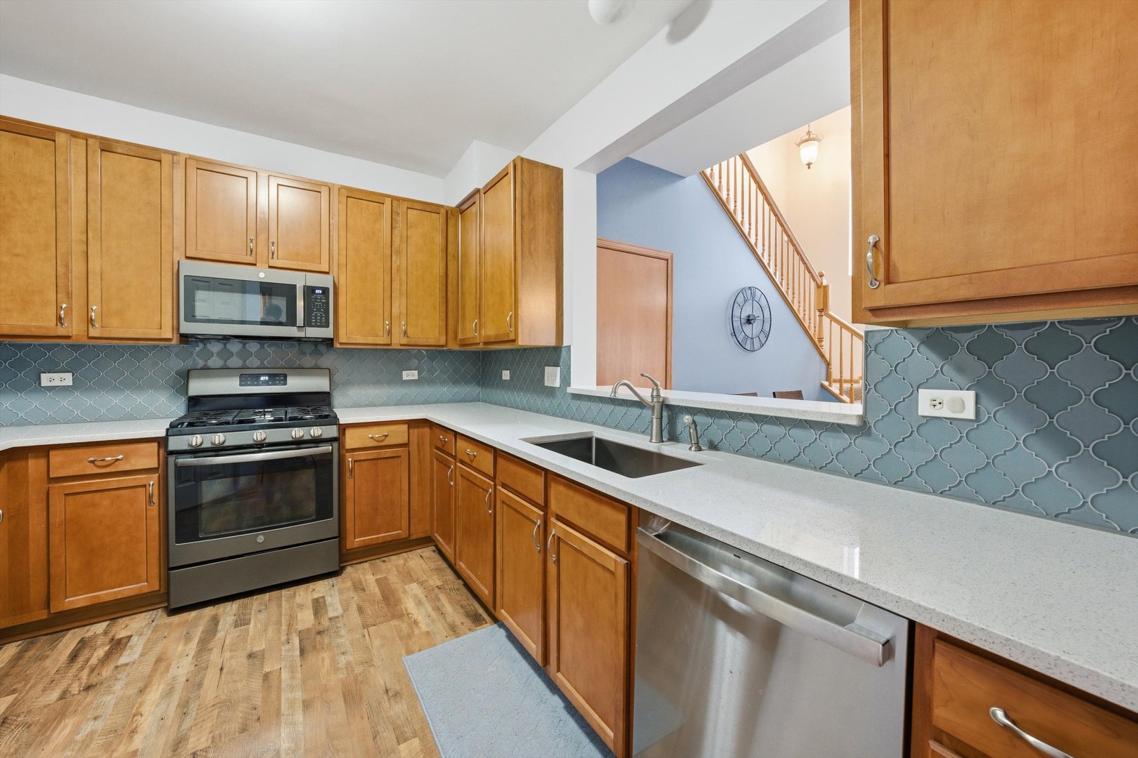 1110 Colonial Drive Joliet, IL 60432 - Photo 10 of 36 a kitchen with stainless steel appliances granite countertop a sink and a stove