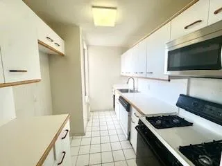 a kitchen with a stove and a microwave