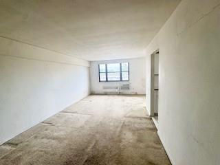 3855 Shore Parkway, Unit 3M Brooklyn, NY 11235 - Photo 9 of 11 a view of an empty room with a window