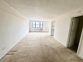 3855 Shore Parkway, Unit 3M Brooklyn, NY 11235 - Photo 10 of 11 an empty room with windows and closet
