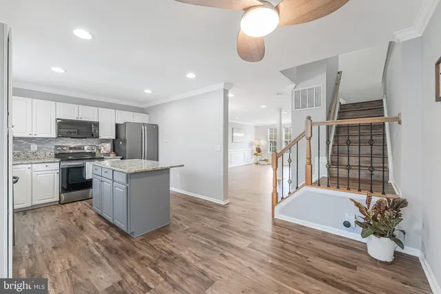 a view of a balcony with wooden floor