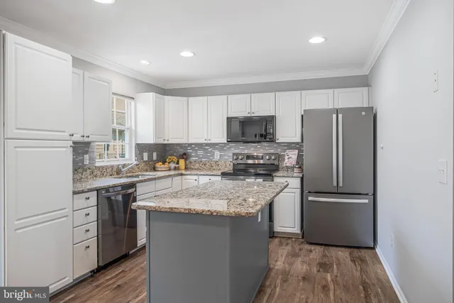 a spacious bedroom with a bed and a window