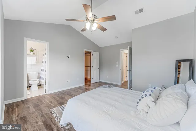 a view of an empty room and wooden floor