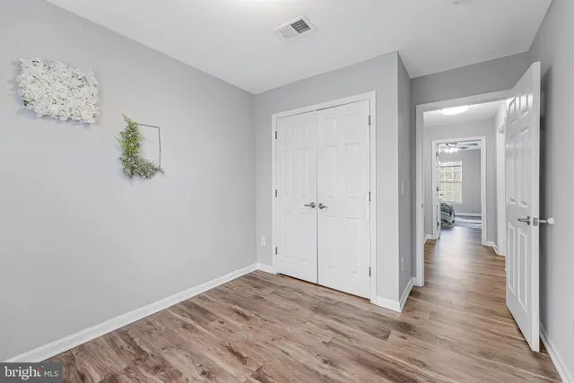 a front view of a house with a yard table and chairs