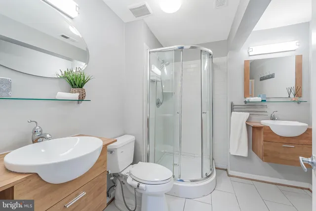 a view of a brick building next to a yard